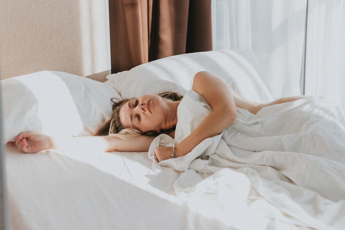 Person sleeping peacefully in comfortable bed